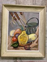 Framed vintage original still life painting on board showing vegetables, a watering can, and cattails