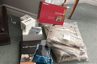 Full lot overview showing KenkoWave box, Palm Mag 1000 boxes, vests packaged, and wraps.