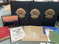 Photo showing the full lot of historical atlases and additional historical books and booklets on Southwestern Ontario counties.