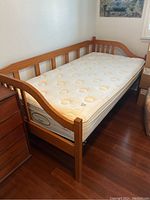 Full view of daybed frame and mattress from angled front