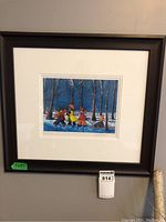 Framed signed limited edition print showing colorful winter scene of children walking in snow under bare trees at night.