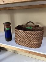 Side view showing both vase and basket on a shelf for size and scale.