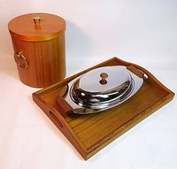 Full lot showing teak ice bucket with lid, teak serving tray, and Glo-Hill stainless steel server with teak handles and glass insert.