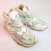 Front-side angle of Nike Lebron XIII Easter basketball shoes, showing wear and colorful swoosh logo details