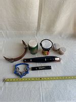 Shows all eight musical items as a group on a white tablecloth background.