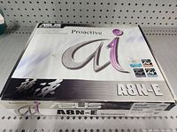 Closed original box for the Asus A8N-E motherboard showing branding and model.