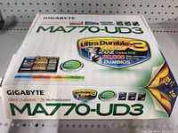 Photo of closed Gigabyte MA770-UD3 motherboard box showing brand and model details