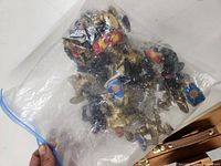 Plastic bag containing several Great Adventures Castle Knights small toy figures in medieval armor with shields and weapons