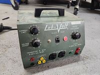 Front view of Lab-Volt Model 354P power supply showing control knobs, switches, and output terminals.