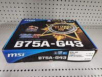 Front and top view of MSI B75A-G43 motherboard box showing Military Class III badge and model name