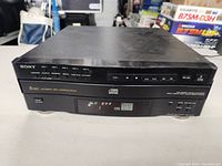 Front view of the Sony 5-disc CD player showing the disc tray, buttons, and branding details.