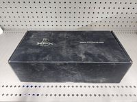 Black rectangular box with XFX logo and website on top, dusty and unopened.