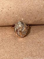 Front view of ring showing swirl cluster design