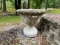 Front-side view showing decorative leaf relief and scalloped rim