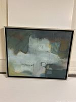 Frontal view of one framed abstract oil painting with dominant muted blue-grey color palette and mixed texture.