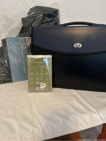 Front view of expandable file folder organizer, packaged calculator, and magazine organizers