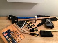 Photo showing the full lot contents including screwdrivers, ice scrapers, brushes, scrub pad, and microfiber cloth.