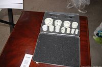 The open Mastercraft hole saw kit showing multiple sizes of hole saws and arbors in molded case.