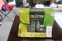 Photo of unopened boxed collection of Dove Men+Care grooming products with bright green packaging showing product lineup.