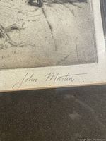 Close-up photo showing artist signature 'John Martin' on the bottom right corner of the etching.