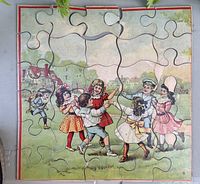 Antique jigsaw puzzle with illustrated children playing in circle, showing all puzzle pieces assembled except missing six pieces at top.