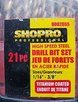Close-up of ShopPro 21-piece titanium coated high speed steel drill bit set packaging with size range 1/16" to 3/8"
