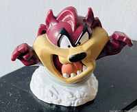 Front view of ceramic Taz cake topper figurine showing detailed colors and facial expression