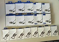 Photo shows 15 items in packaging: 10 HDMI to DVI-D cables and 5 3.5mm universal FM transmitters from Insignia brand.