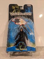 Sealed Van Helsing Monster Slayer action figure in original blister pack with box damage visible at the top and sides.