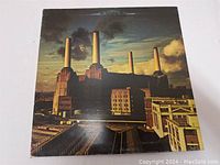 Front cover of Pink Floyd Animals LP record showing Battersea Power Station with pig blimp.