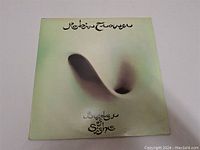 Original album cover of Bridge of Sighs by Robin Trower with stylized text and abstract artwork.