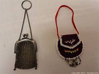 Photo of both vintage change purses side by side on a white background to show relative size and design.