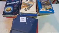 Image showing a variety of aviation books stacked, titles visible include From the Ground Up along with other aircraft books.