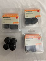 Three unopened packs of black vinyl chair leg feet protectors measuring 3/4 inch diameter each, brand Certified.