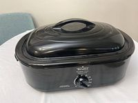 Side view of the black Rival roaster oven closed with lid.