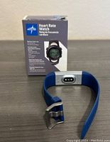 Medline Heart Rate Watch with blue wristband displayed sitting next to product box with detailed product information.