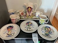 Overall view of set: coffee pot, creamer, sugar bowl on tray, three mugs at back, and three luncheon plates in front