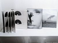 Open accordion-style sleeves showing multiple Blu-ray discs, slipcase cover and inner panel artwork