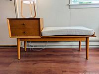 Front view of table and seat with drawer closed