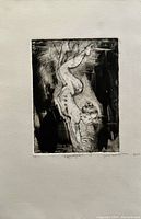 Full view of the black and white print showing the nude woman balancing on one hand with artist signature and numbering.