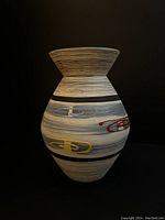 Front view of the Mid-Century Modern Austrian ceramic vase showing multi colored oval patterns and banded design.