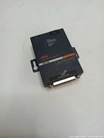 Front side of Lantronix UDS1100 device server showing model number, ports, and branding.