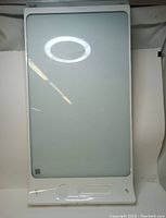 Front view of the SMART kapp digital whiteboard showing clean white glass surface, 42-inch with frame and bottom QR code