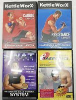 Front cover of four workout DVDs including KettleWorX Cardio Level II, KettleWorX Resistance Level II, S.W.A.T Workout system, and T'AEROBICS aerobics DVD.