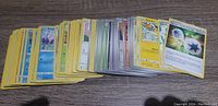 Loose assortment of Pokemon cards fanned out on flat surface