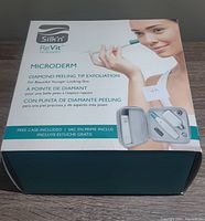 Box front showing product branding and general product purpose, includes image of carrying case with device and accessories inside