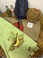 Overview of aprons, baskets, and Coca-Cola bottles shown together