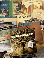 Several vintage vinyl album covers partially overlapping, including classical and choral music titles.
