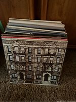 Stack of record albums viewed from front, Physical Graffiti cover visible