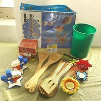Photo showing full lot of bamboo utensils, ceramic dip cooler, placemats, candle holders, and Texas salt and pepper shakers on green tablecloth